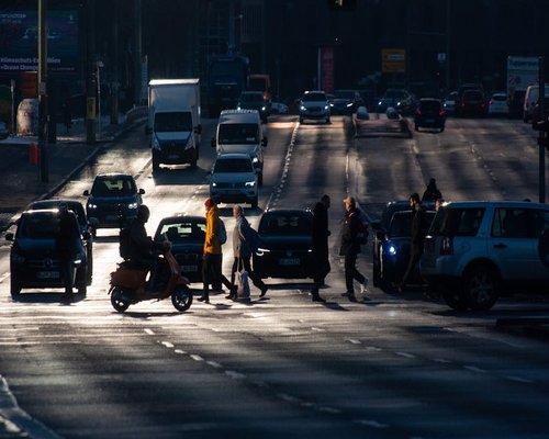 Busy urban street in the morning with people commuting